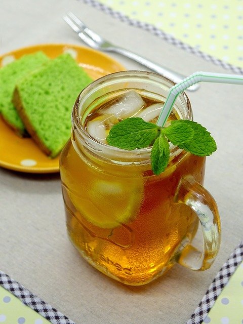 A jar with ice tea and lemon slice