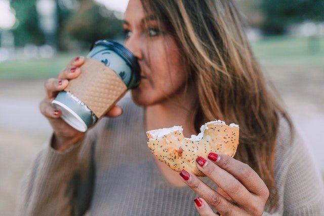 girl eating sandwich being on a keto diet