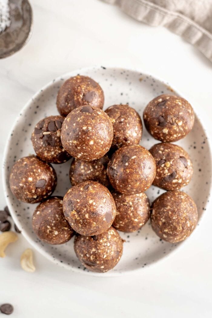 Overhead image of a plate of chocolate chip energy bites.