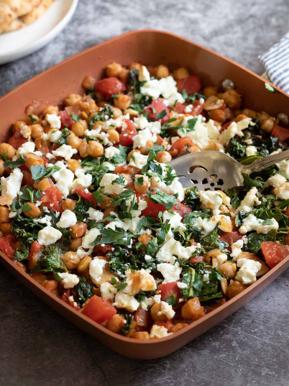 Mediterranean chickpea skillet recipe in a square pan.