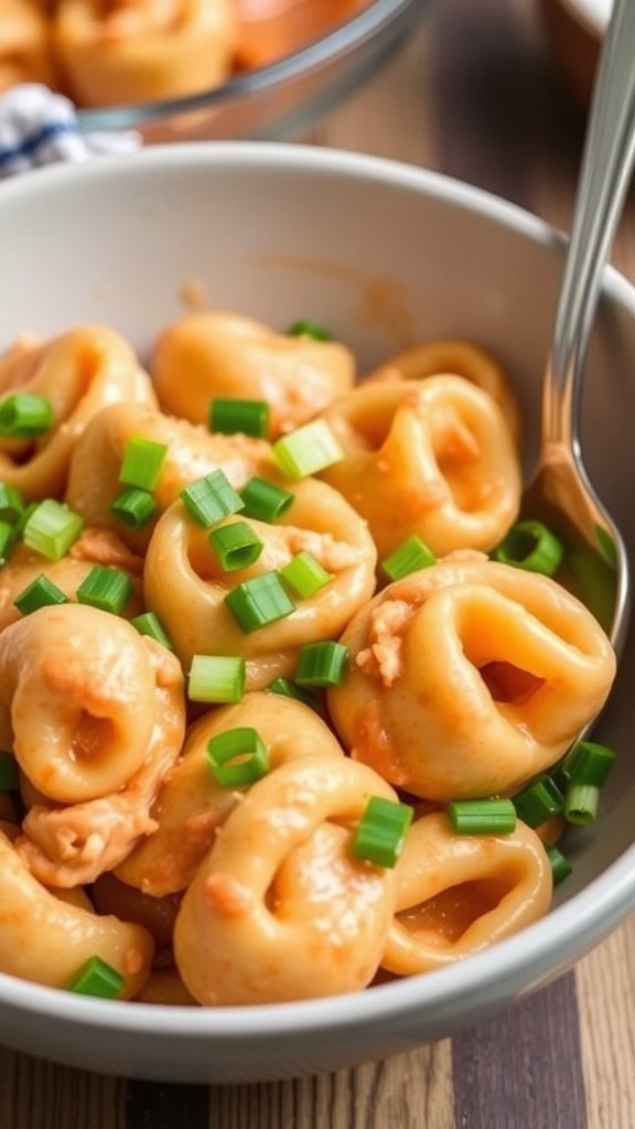 A delicious bowl of Buffalo Chicken Tortellini topped with green onions.