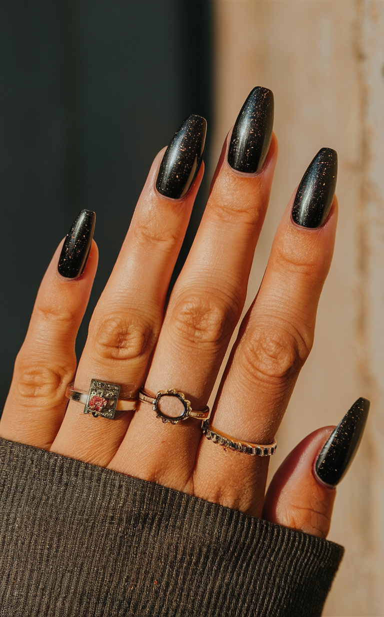 5. Black Metallic Speckled Nails